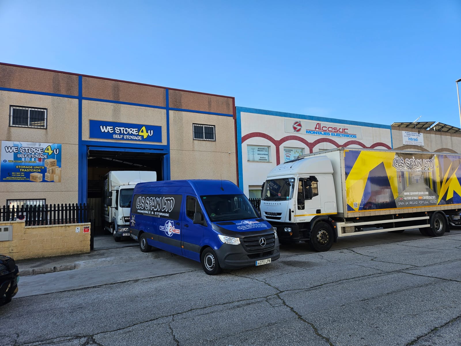 CLS Spain blue and white branded removal trucks